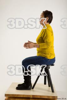 Sitting reference of yellow sweater blue jeans Gwendolyn 0009